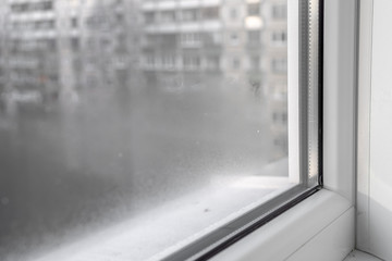 Water condensation on PVC windows during autumn. Plastic window.