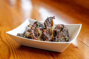 Grilled Chicken Ribs with Herb Garnish