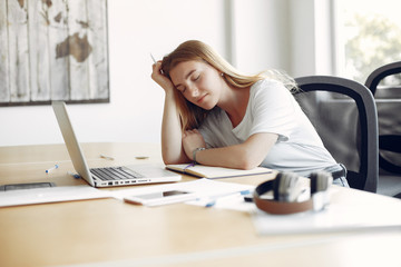 Students sleeping at the table. Girl learning and use the laptop