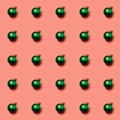 Christmas ball on pink background. Fashionable colors 2020 Eden and Peach Pink. seamless pattern