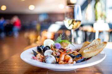 Bouillabaisse Seafood Soup Close-Up with Shrimp, Muscles, Clams, Fish, Fennel , Grilled Bread, and...