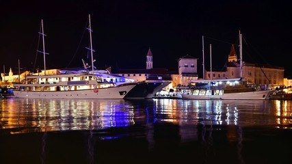 Croatia Trogir yachts and boats in port at night
