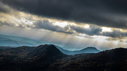 Dark hill and grey clouds