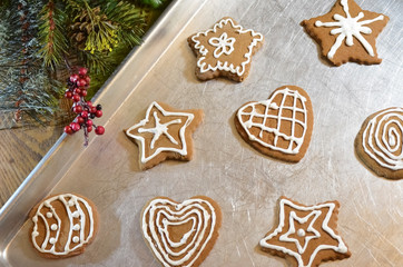 Gingerbread Christmas Cookies on Baking Pan with Decorative Greenery
