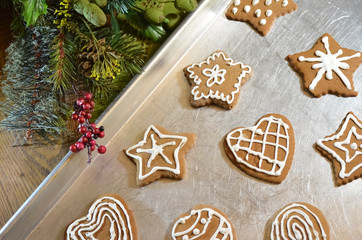 Gingerbread Christmas Cookies on Baking Pan with Decorative Greenery