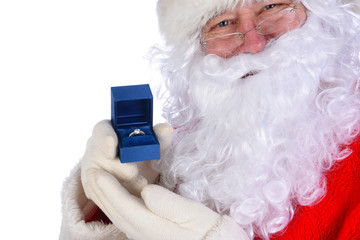 Santa Claus holding a diamond engagement ring in a blue box closeup next to his face.