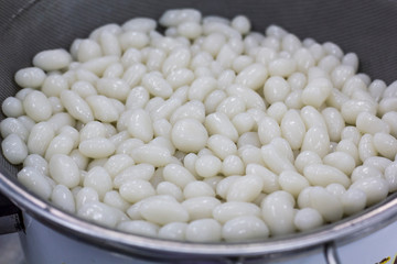Prepare white flour ball to make popular Thai dessert called Pla Krim Kai Tao, Sweet Rice Noodles with Coconut Cream seperate to two parts,white sour part mix with sweet part make by brown sugar syrup
