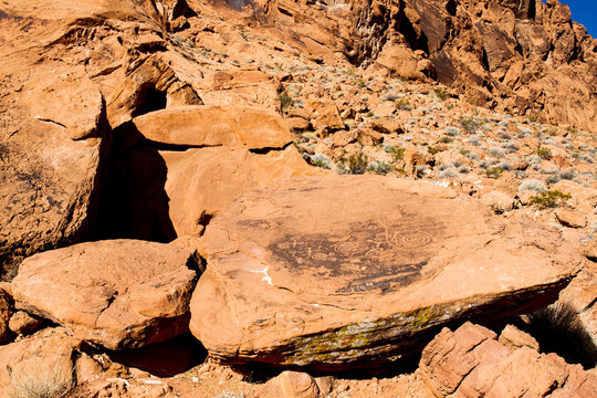 Pre-columbian Native American petroglyphs on a large rock in its natural setting in Valley of Fire State Park in Nevada