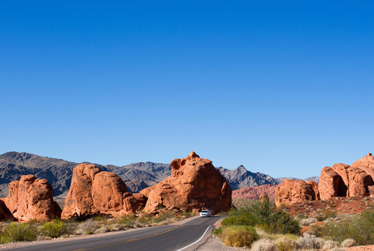 Car on scenic drive through the "Seven Sisters" rock formation at Valley of Fire State Park in Nevada