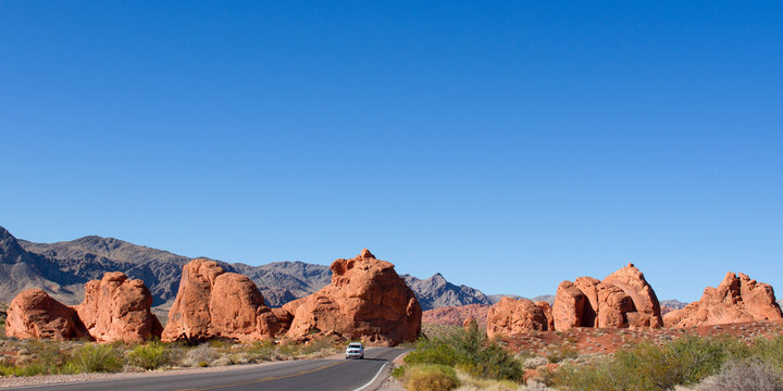 Car on scenic drive through the "Seven Sisters" rock formation at Valley of Fire State Park in Nevada