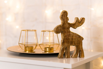Christmas decorations, two candles and wooden moose