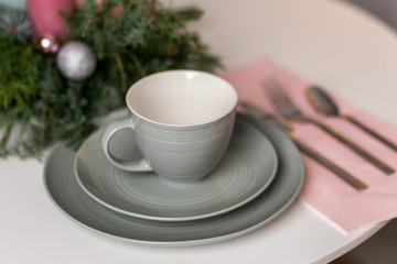 cup of coffee and Christmas decorations on table