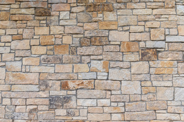 Ancient red stone wall flat background closeup