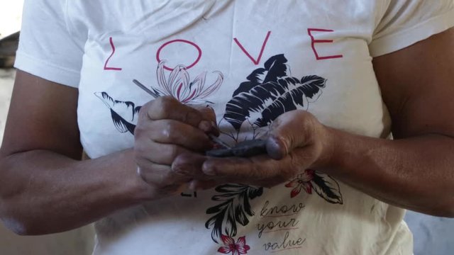 A woman makes pottery pieces