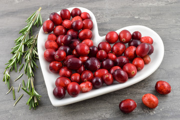 Cranberries on Heart Shaped Dish with Festive Rosemary Herbs