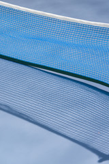 Detail of table tennis net with shadow.