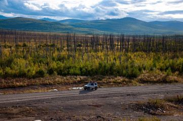 4x4 SUV during the autumn expedition in difficult conditions.