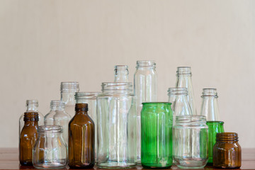 Variety shape and color of empty glass container bottles, reuse things concept
