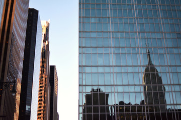Reflection of New York building in glass windows of a skyscraper, New York, NY, USA