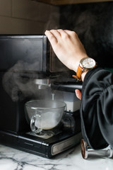 woman making espresso watch hand cute steam hot