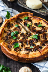 Jellied pie with meat and mushrooms on potato dough