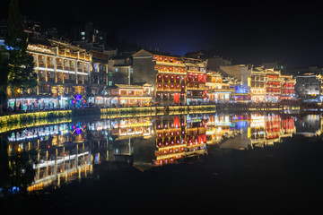 Colorful traditional Chinese buildings reflected in water
