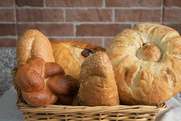 square bread basket with some bread ready for breakfast