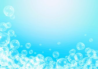 Fototapeta na wymiar Soap bubbles on a blue background with copy space