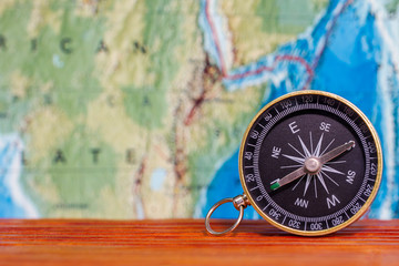 Fototapeta na wymiar Compass on the map and travel ideas.