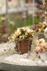 Fototapeta na wymiar flowers in jar show on the stone table