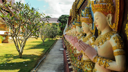 The sculpture wall according to Thai art in the temple