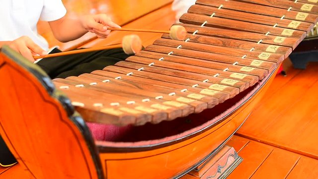 Boys playing xylophone instruments in youth music performance,Thai Xylophone music player