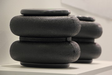 Rubber air cylinder close up on white background, truck pneumatic suspension spare parts, repair