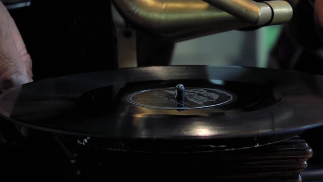 Male Hands Placing Vinyl Record on Retro Gramophone - Vintage Music Player