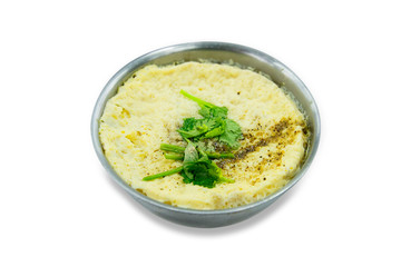 Steamed egg with celery on a stainless steel round bowl