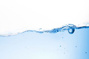 Blue water waves and bubbles in drinking water. Isolated background