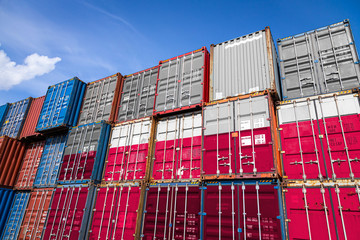 The national flag of Argentina on a large number of metal containers for storing goods stacked in rows on top of each other. Conception of storage of goods by importers, exporters