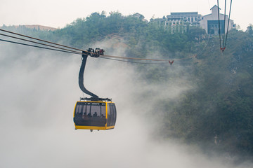 Cable car carrying passengers to Fansipan (3,143 m) mountain the highest mountains peak in Vietnam. This is the world's longest electric cable car. © boyloso