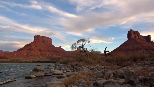 Shoreline of the Colorado River flowing through Utah desert in Castle Valley at sunset.