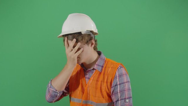 Adult Man Engineer Rubbing Face With Frustration