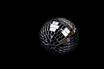 Chistmas disco ball on black background. Contrast concept.
