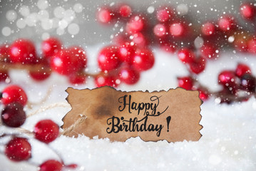 Fototapeta na wymiar Burnt Label With English Calligraphy Happy Birthday. Red Christmas Decoration With Snow And Snowflakes
