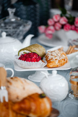 Obraz na płótnie Canvas buns and cakes in a white plate