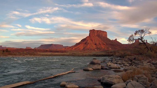 Wild west landscape in the Utah desert on the shore of the Colorado River at sunset.