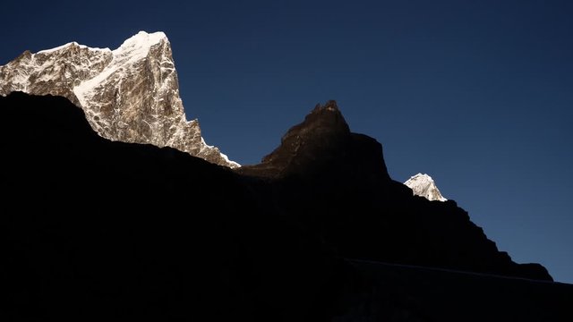 Stunning Cholatse Mountain View with Crystal Clear Cloudy Sky with birds fly