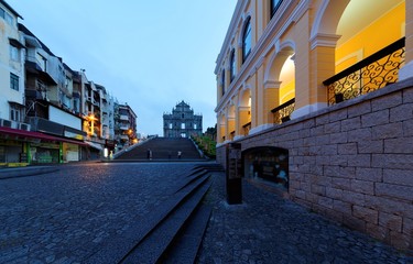 Obraz premium Scenery of the Ruins of St. Paul's Church in the Historic Center of Macau, China, with a paved promenade & a stairway leading to the beautiful facade of the historical architecture in morning twilight
