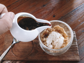 cup of coffee with sugar on wooden table