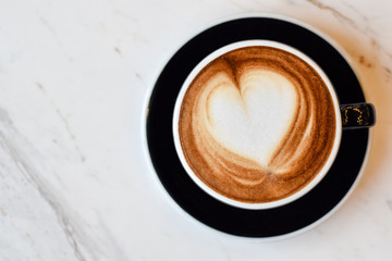 ็High angle view, Coffee latte art on marble table.