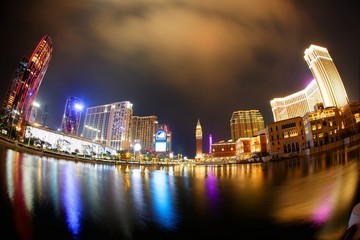 Night scenery of the extravagant exterior of  luxury hotels & casino resorts in Macau, China, with...