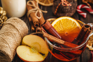 Christmas composition with Glass of glint wine on wooden table close up